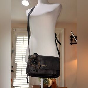 Nora Lozza Black Leather Crossbody Bag with Copper Flecked Flower details.